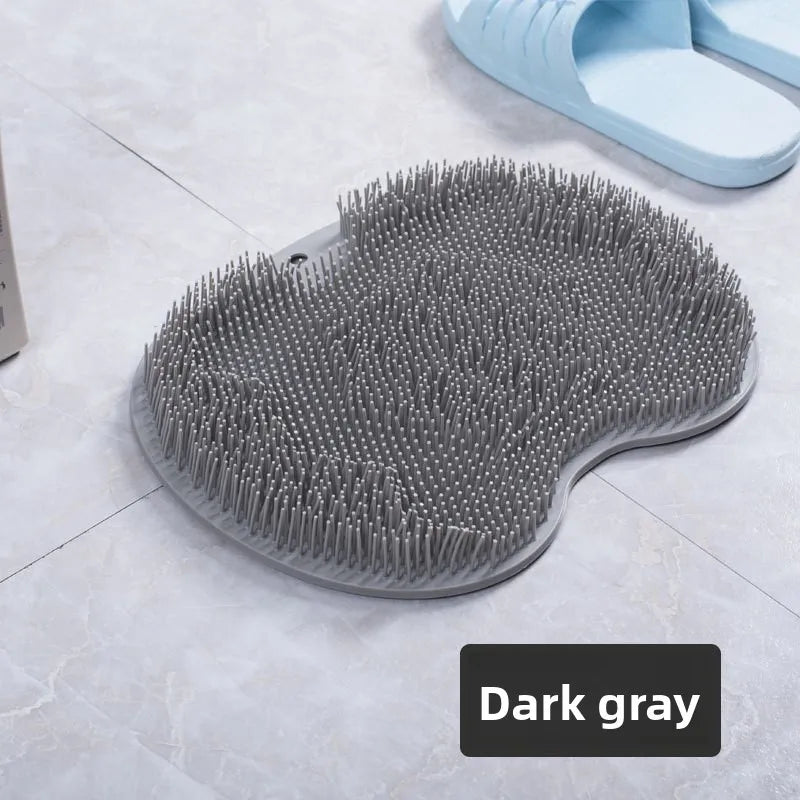 Dunkelgraue Fußmassagematte mit vielen Silikonspikes, gezeigt auf einer hellen Oberfläche.