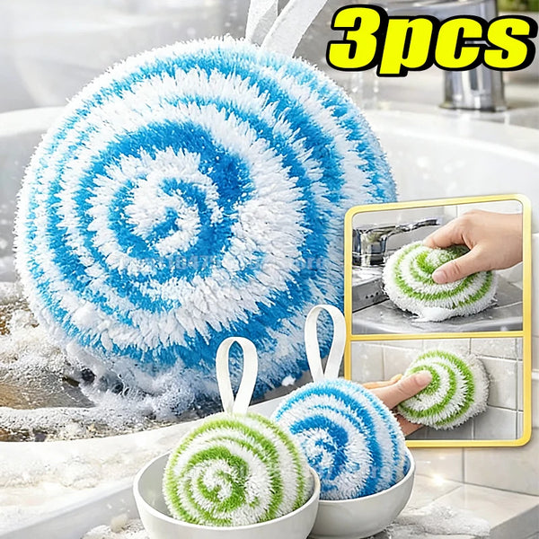 Three multi-color nano cleaning scrubbing balls are shown in a white bowl and being used to clean a sink.