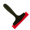 A black silicone scraper with a red edge used for grout and gap filling.