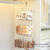 A white multi-layer clip drying rack displaying various knitted items and accessories for laundry storage