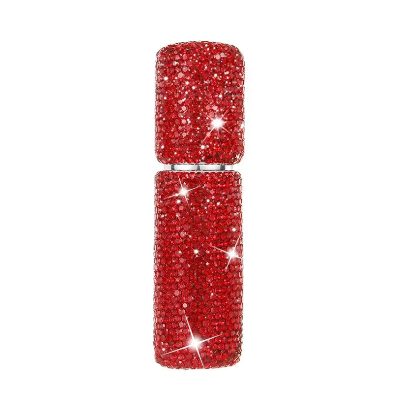 A pair of red glitter diamond glass perfume spray bottles.