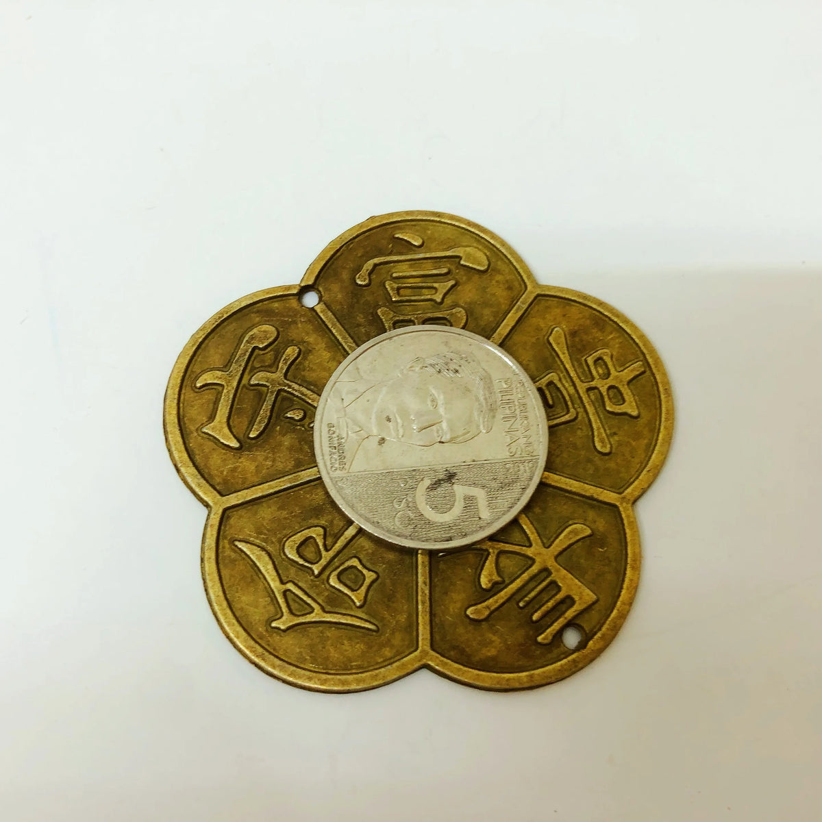 A round copper coin with traditional Chinese characters embossed on its surface.