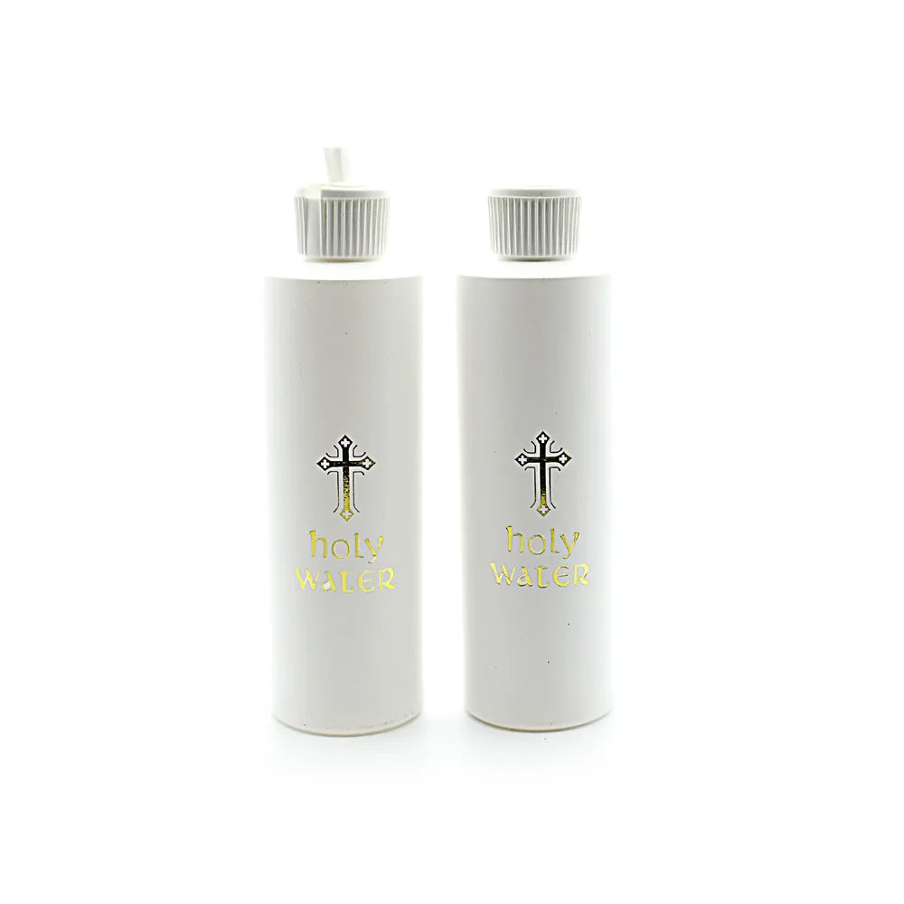 A white bottle of holy water with a silver cross design and a white cap.