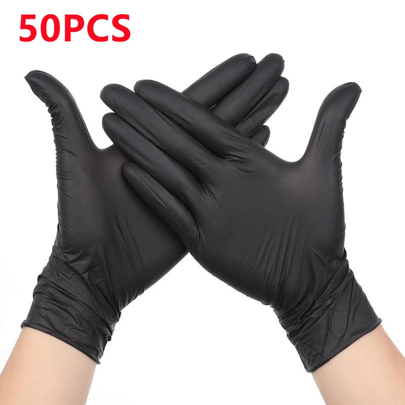 A pair of black heavy duty disposable nitrile work gloves crossed together