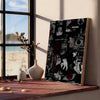 A framed poster featuring dark, abstract imagery and stylized figures displayed on a wooden shelf next to a window.