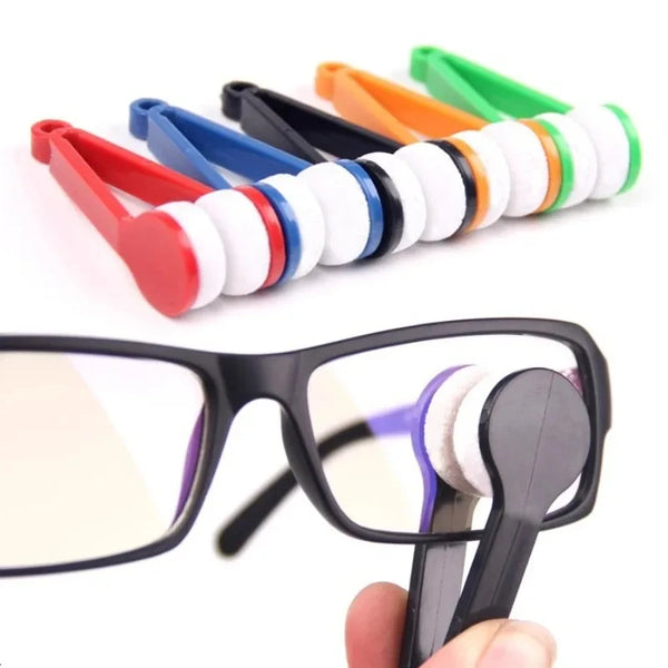 A hand holds a set of colorful multifunctional eyeglass cleaning cloths with various colored rings.