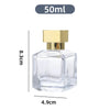 A clear glass perfume spray bottle with a gold cap, shown against a white background.
