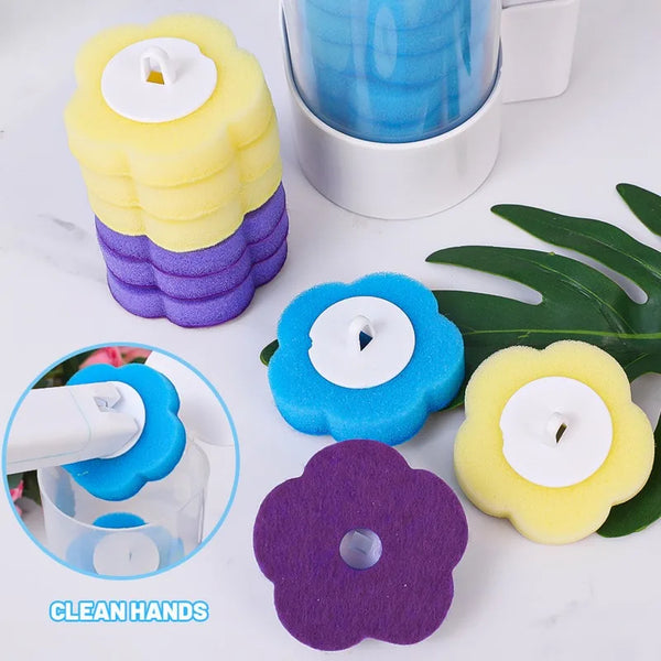 Yellow and purple disposable toilet cleaning foam sponges next to a cup and green leaves.