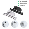 Black and silver wall mounted toilet paper holder with a roll of toilet paper visible