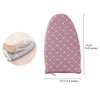 A pink heat resistant ironing pad with a diamond pattern, shown next to a hand for scale.