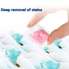 Hand applying pink laundry fragrance beads onto white fabric for deep stain removal