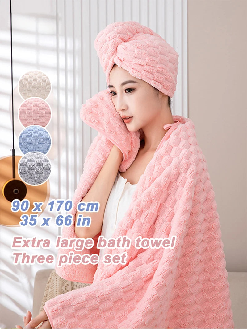 A pink three-piece set of extra large bath towels is displayed on a person, with color options shown in the background.
