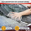 A hand wipes water spots off a car's exterior using a gray microfiber cloth for high absorption cleaning.