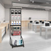 A black mesh grid display hook rack holding various black headphones and storage boxes in a modern office setting.