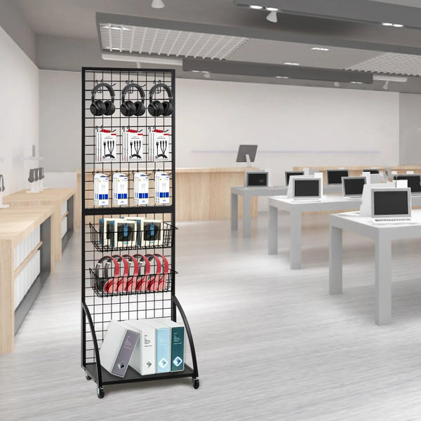 A black mesh grid display hook rack holding various black headphones and storage boxes in a modern office setting.