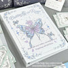 A white photo album featuring a butterfly design and floral elements, with loose leaf pages visible.