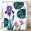 A shower curtain featuring a tropical garden design with large green monstera leaves and purple orchid flowers.