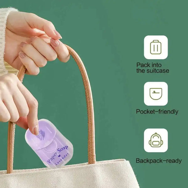 A hand is placing a lavender-scented soap sheet into a woven bag, demonstrating its portability.