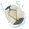 A white durable shoe washing bag is shown being rinsed with water.
