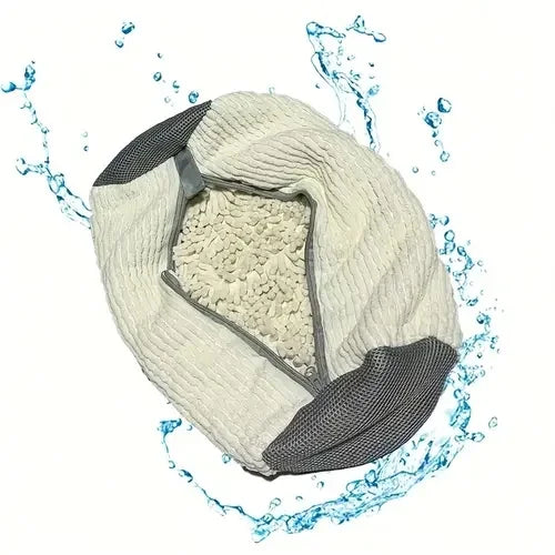 A white durable shoe washing bag is shown being rinsed with water.