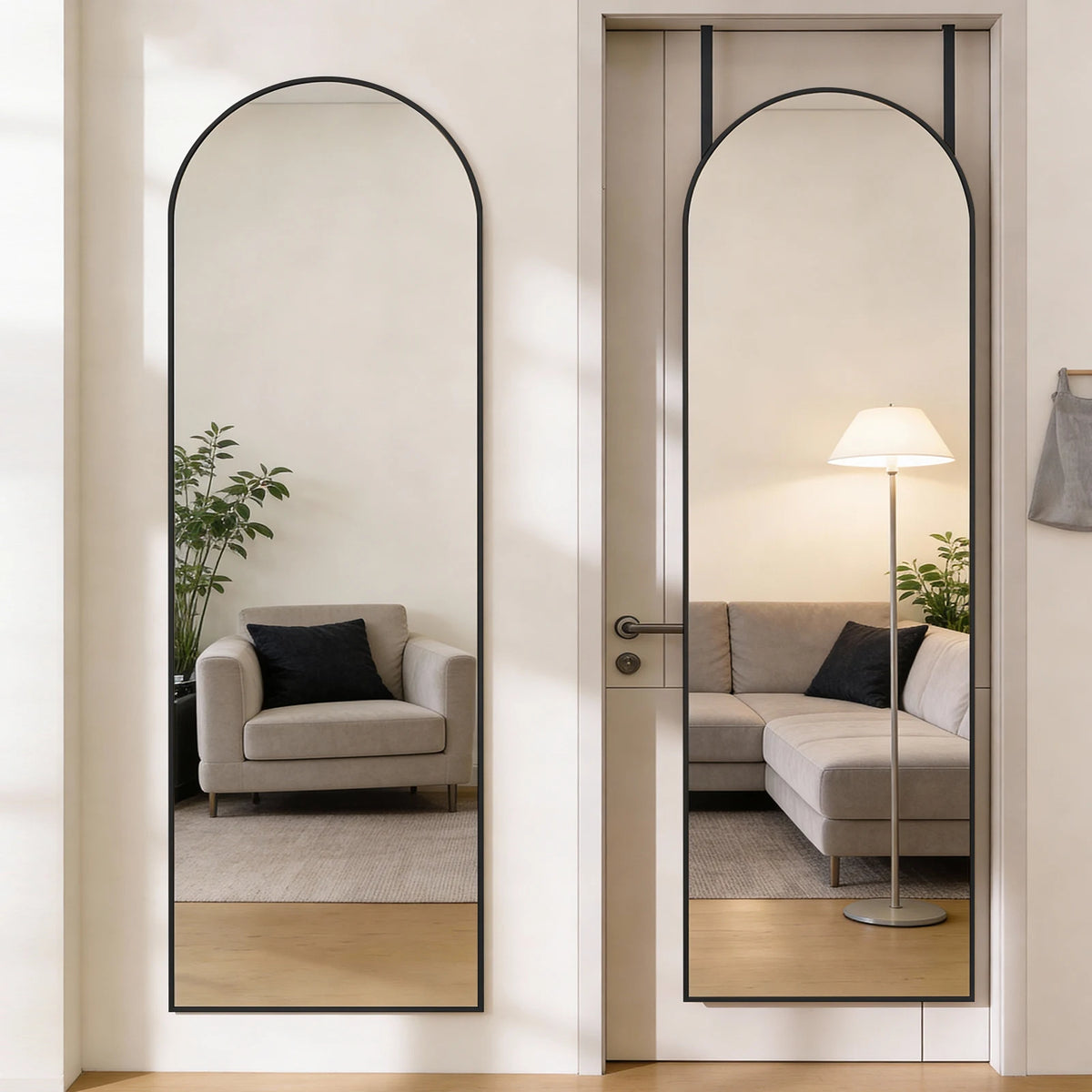 A full body wall mirror with an arched top and thin aluminum frame reflecting a modern living room interior.