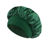 A dark emerald green satin sleep bonnet for hair and head.