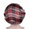 A black and red plaid satin sleep bonnet worn on a mannequin.