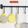 A hanging design display of yellow and gray kitchen cleaning towels and dish sponges on a black bar.