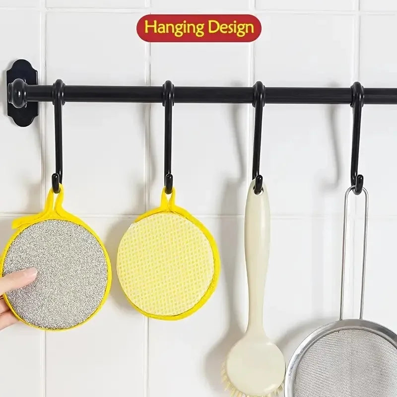 A hanging design display of yellow and gray kitchen cleaning towels and dish sponges on a black bar.