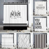 A set of abstract geometric line shower curtains in black and white featuring motivational text