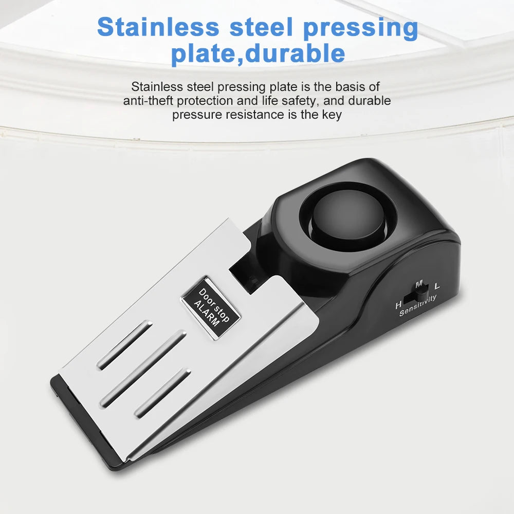 Tapón de puerta de placa de acero inoxidable negro con alarma y dial de sensibilidad.