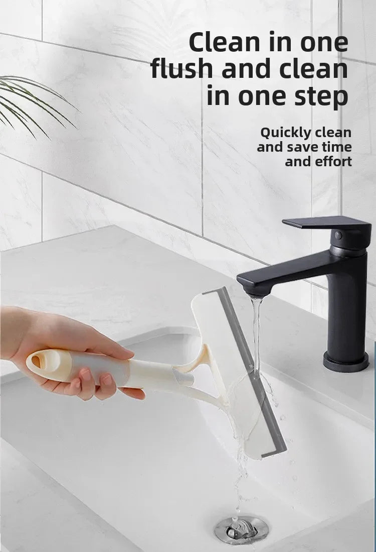 A hand is using a multi-function glass cleaner and scraper to clean a sink, showing water flowing from the device.