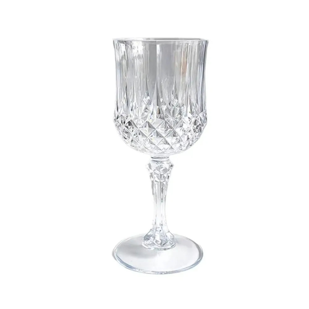 Clear glass champagne flute with cut diamond pattern