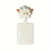 A white cartoon toilet seat lifter handle with a fluffy, light-colored head design.