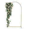 Adjustable gold arch stand decorated with white and pink floral greenery for party backdrop
