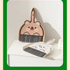 A set of cartoon animal broom and dustpan featuring a bear design in light brown and gray.