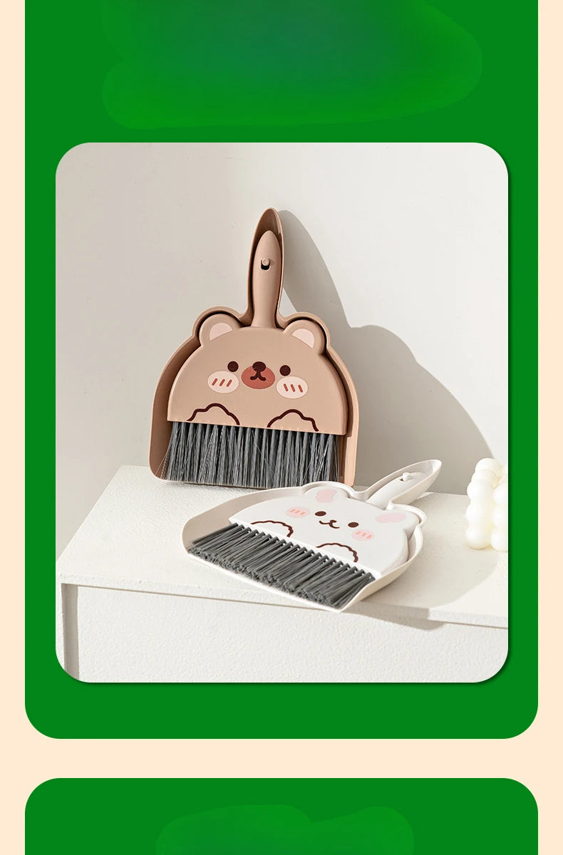 A set of cartoon animal broom and dustpan featuring a bear design in light brown and gray.