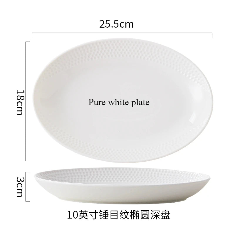 A set of pure white ceramic soup bowls, including a large plate and a smaller bowl.