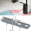 A silicone kitchen sink splash guard mat is shown with water flowing over it, demonstrating its use for preventing splashes.