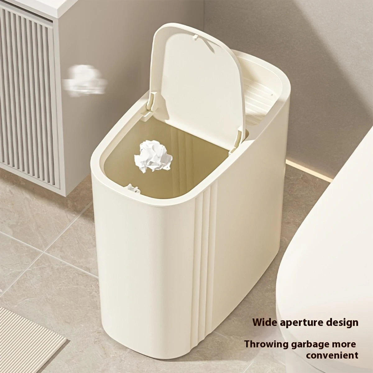 A white odor-sealing trash can with a press lid is shown on a floor, highlighting its wide aperture design for convenient thr