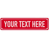 A rectangular red metal sign with white text that reads YOUR TEXT HERE.