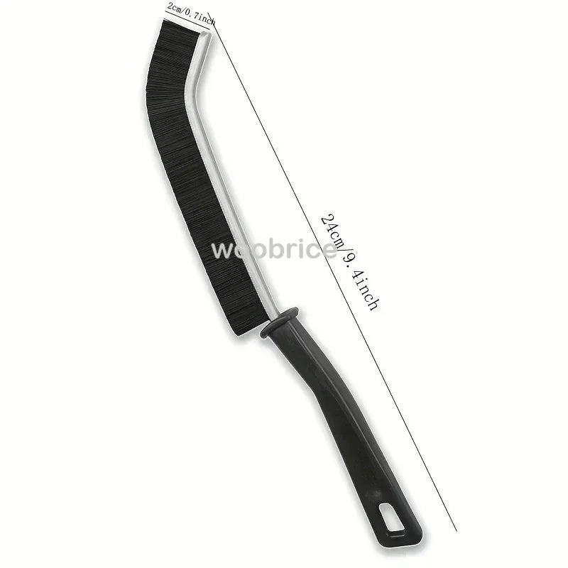 A black multifunctional hard bristle crevice cleaning brush with a long handle.