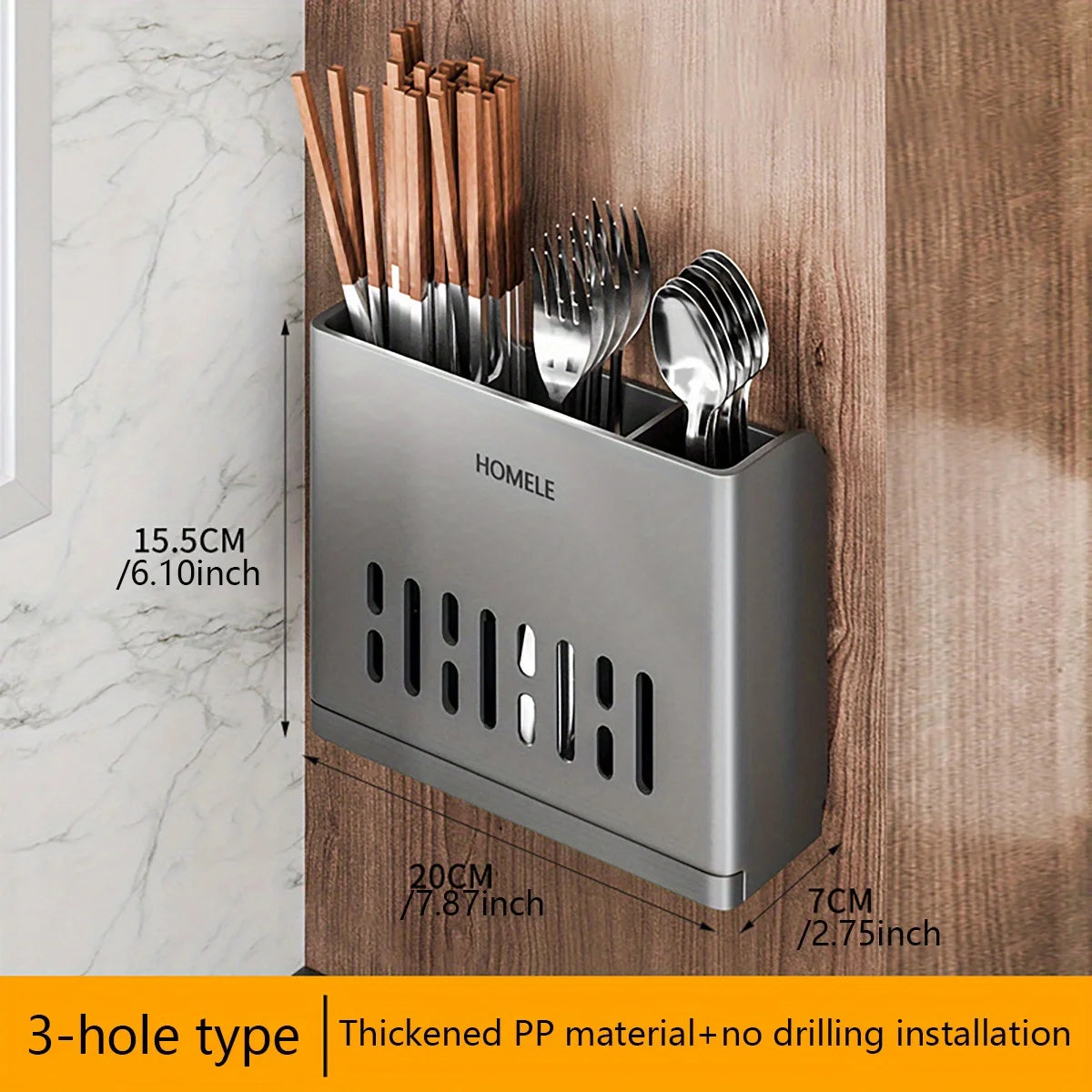 A silver cutlery storage rack with a 3-hole design is mounted on a wooden surface.