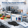 A box of disposable nitrile gloves is displayed on a stainless steel counter in a professional kitchen setting.