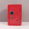 A red metal piggy bank with a combination lock and a textured surface is shown against a neutral background.