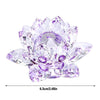 A clear crystal lotus flower centerpiece with purple and pink facets used as tabletop decor.