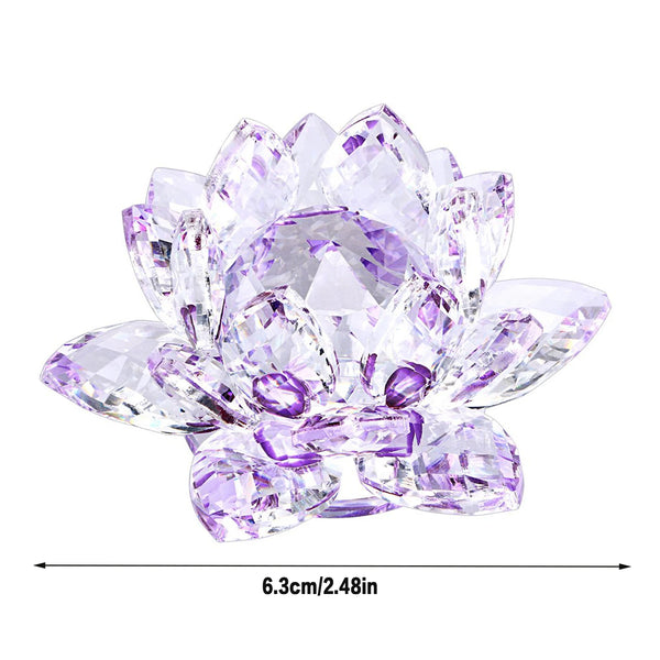 A clear crystal lotus flower centerpiece with purple and pink facets used as tabletop decor.