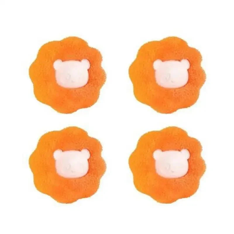 Four orange laundry balls shaped like dog heads for pet hair catching