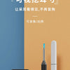 A black visual ear cleaning tool with a white handle is displayed against an orange background.