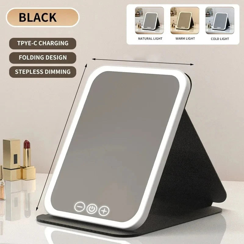 A black portable touch screen vanity mirror with adjustable natural, warm, and cold LED lights displayed on a stand.